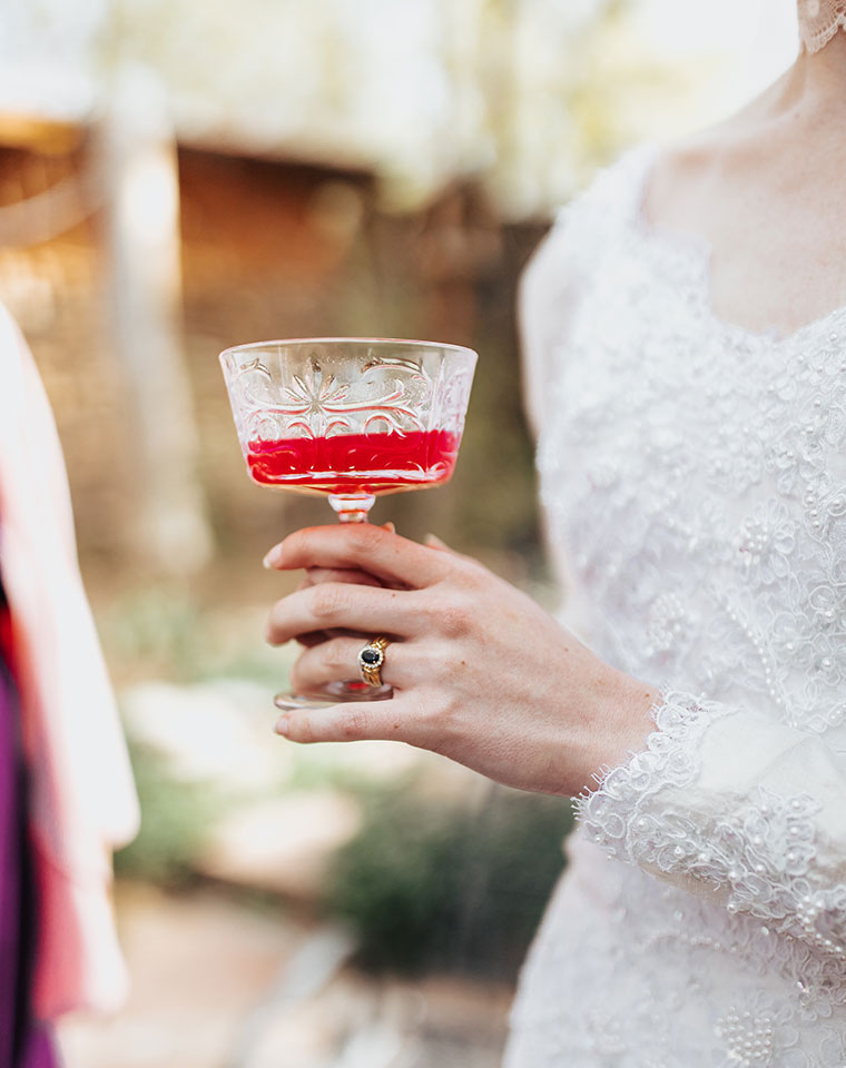 bride holding cocktail