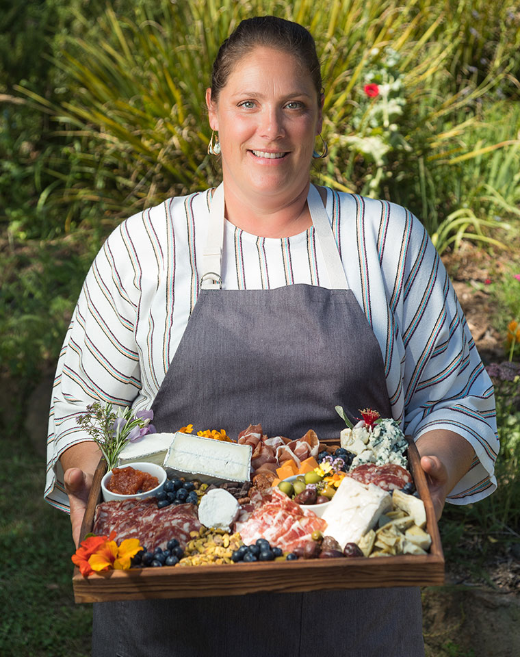 catering in Taos New Mexico - chef Jen holding a meat and cheese platter